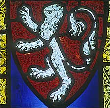 The Mowbray lion in a stained glass window.